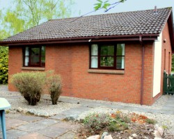 Cairngorm Holiday Bungalows, Coire Cas - enclosed rear garden